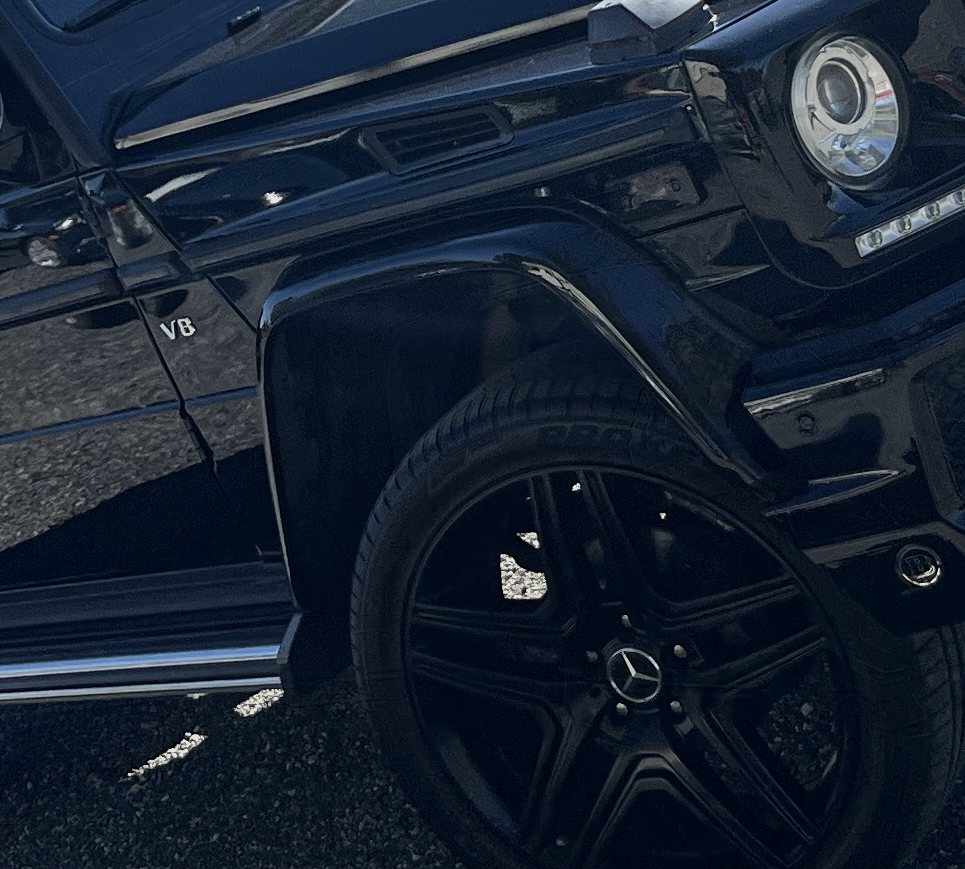 Black Mercedes-Benz G-Class V8, front wheel and headlight